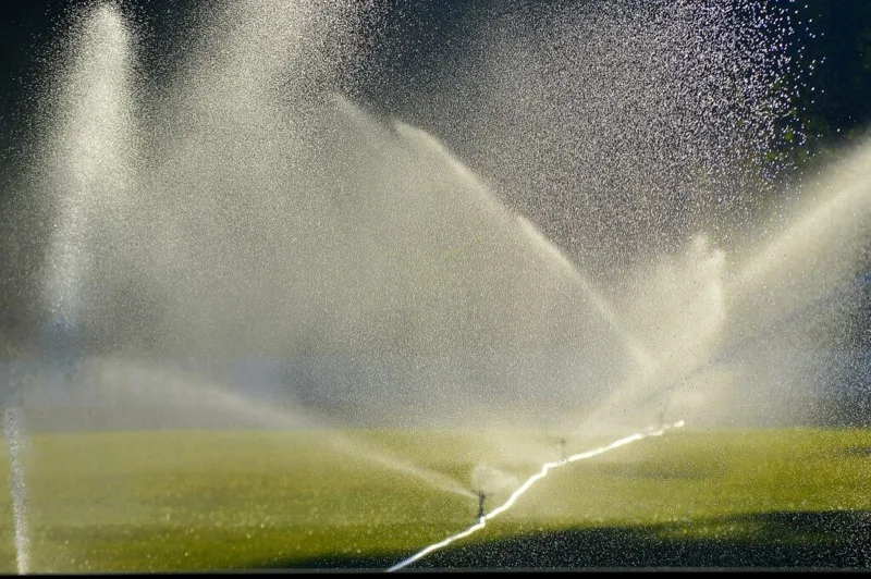 Irrigation sprinkler system watering a lawn